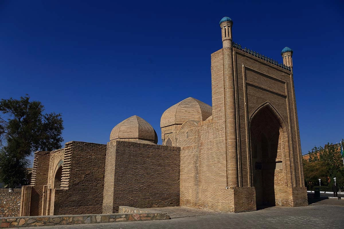 Chashma-Ayub Mausoleum in Bukhara with a brick portal and domes