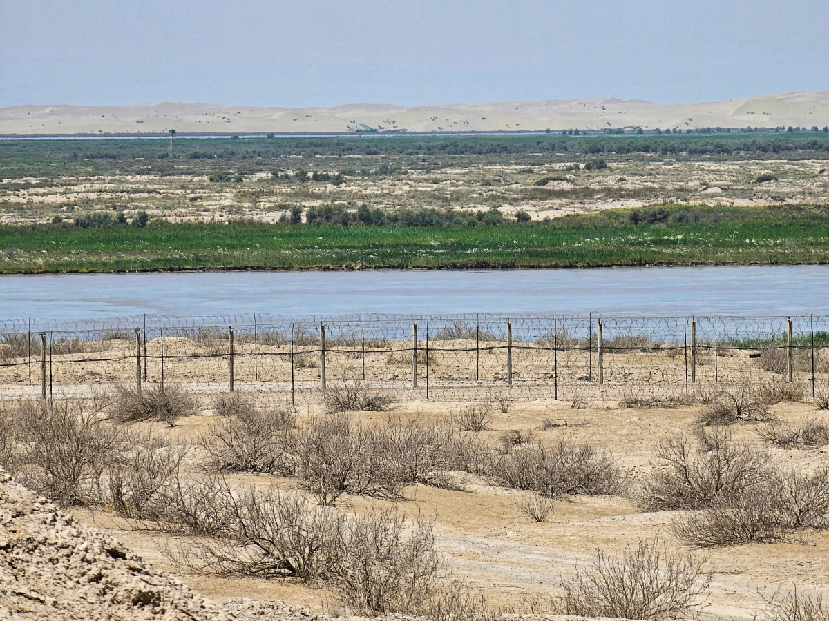 Southern Uzbekistan landscape near Termez Southern Uzbekistan landscape near Termez with water, dry ground and open horizon