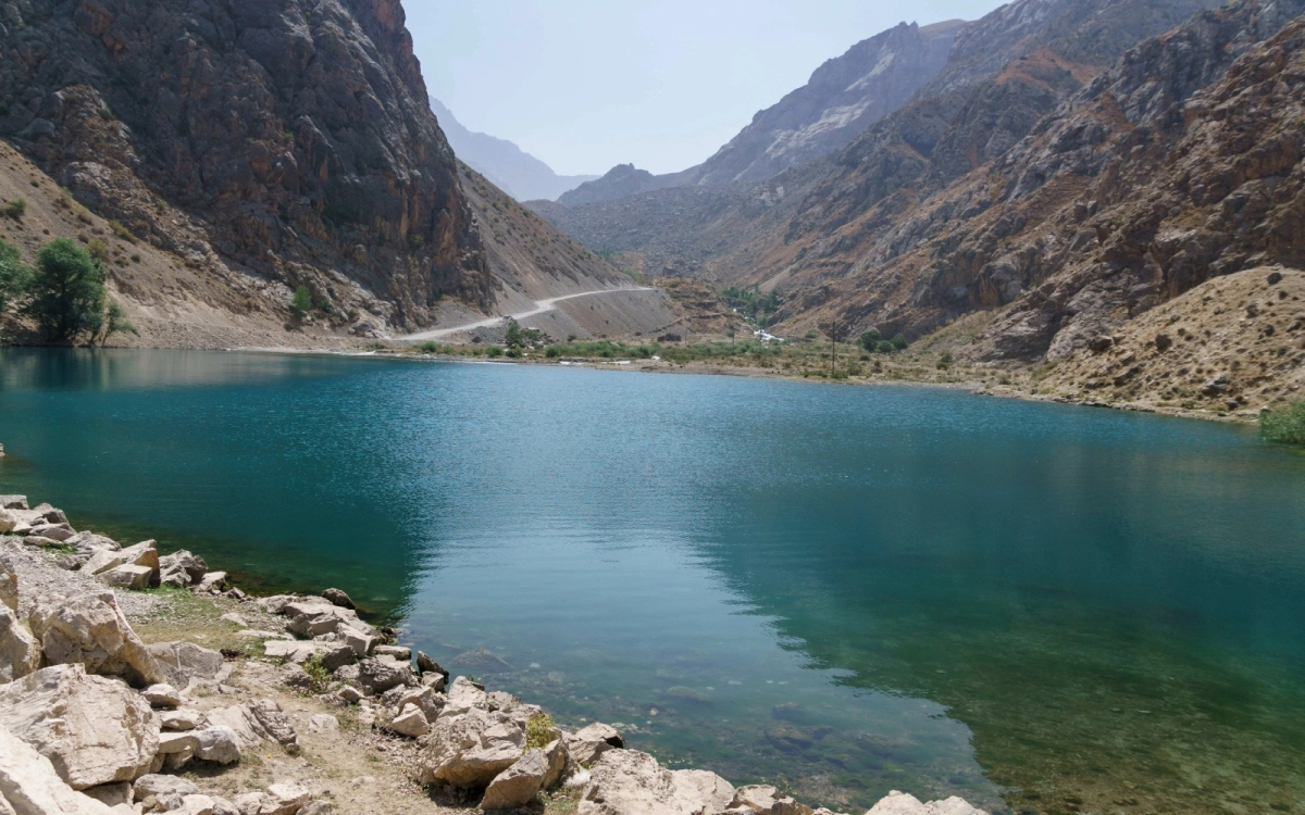 Turquoise mountain lake and rocky slopes in Tajikistan's Seven Lakes