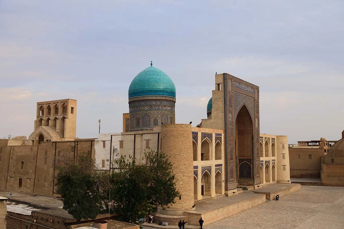 Miri-Arab Madrasah and blue domes of the Poi-Kalyan complex in Bukhara