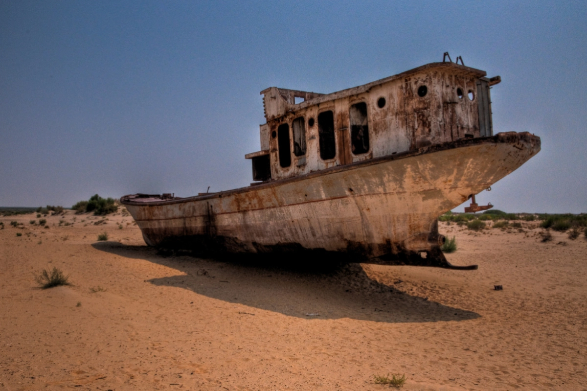 Rusting ship on sand in Muynak, Karakalpakstan