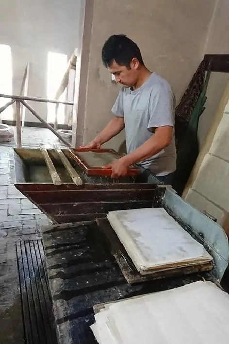 A craftsman makes paper by hand in Konigil near Samarkand