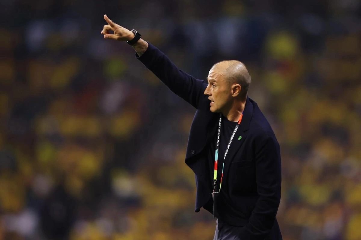 Uzbekistan staff member giving instructions from the touchline