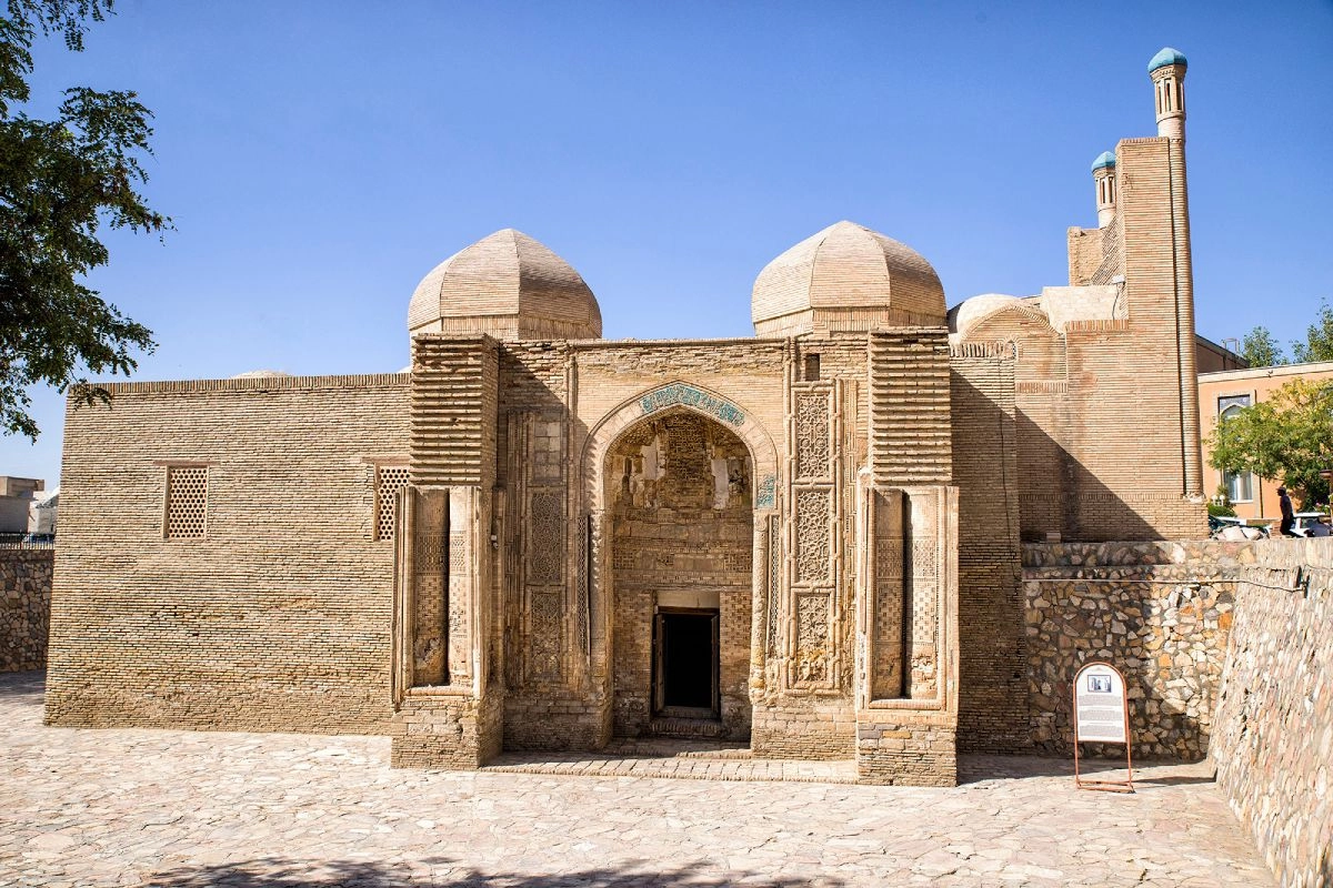 The brick façade and carved portal of Magoki Attori Mosque in Bukhara