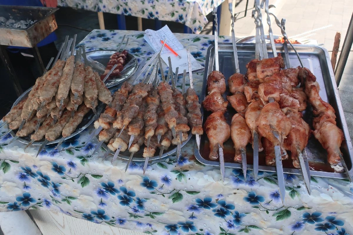 Trays of minced-meat, meat-chunk and chicken shashlik