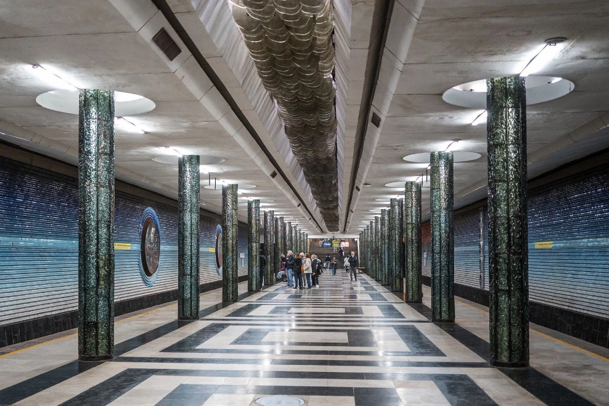 A Tashkent metro platform with columns and circular wall panels