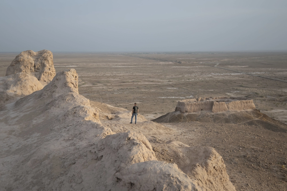 Desert view from ancient Khorezm fortress ruins View from eroded mud-brick ramparts across a wide desert plain in ancient Khorezm