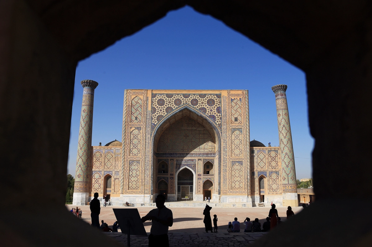 Registan Square in Samarkand seen through an arch