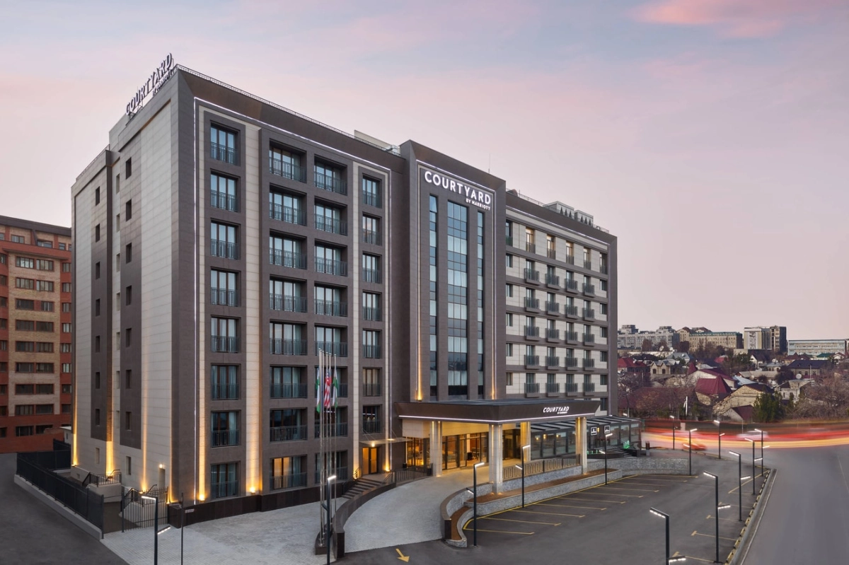 Courtyard by Marriott Tashkent exterior at dusk