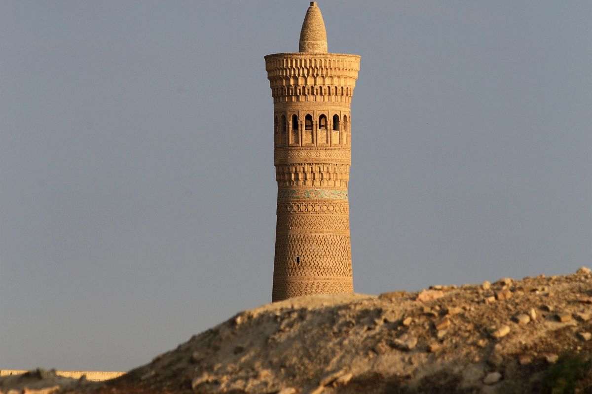 Kalan Minaret in Bukhara behind an earthen wall