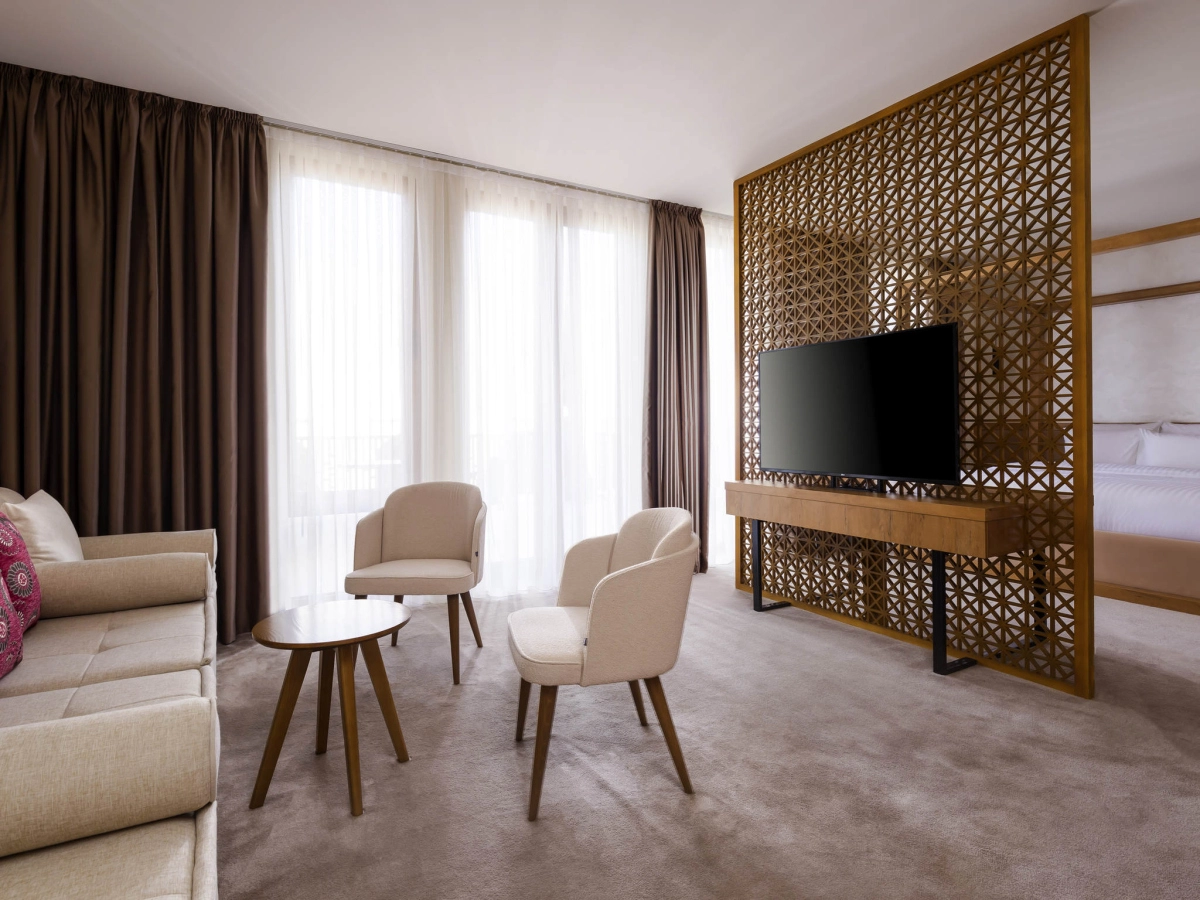 Balcony Suite sitting area and partial King sleeping area at Mercure Bukhara Old Town